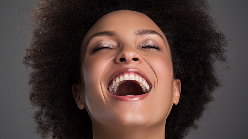 woman with a clear complexion smiling